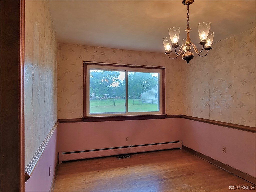 7529 Wilton Road Henrico, VA 23231 - Photo 13 of 31 a view of a room with wooden floor and fan