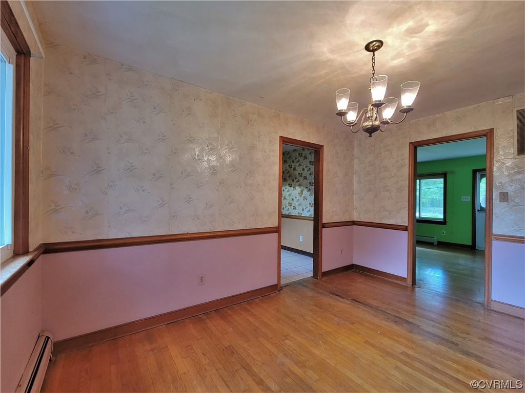 7529 Wilton Road Henrico, VA 23231 - Photo 14 of 31 a view of a room with wooden floor and potted plant