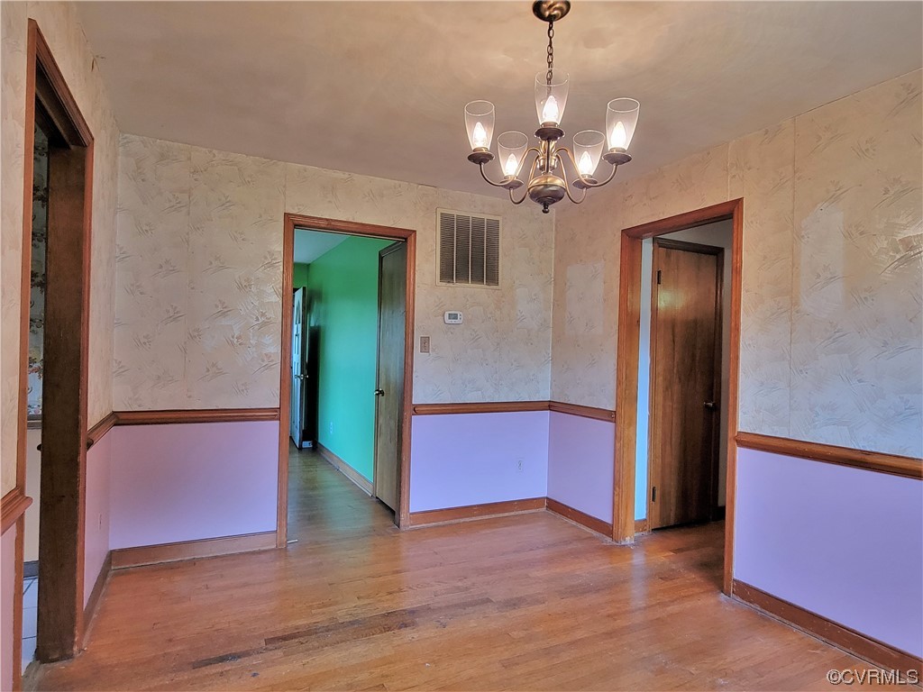 7529 Wilton Road Henrico, VA 23231 - Photo 16 of 31 a view of a room with a chandelier and wooden floor