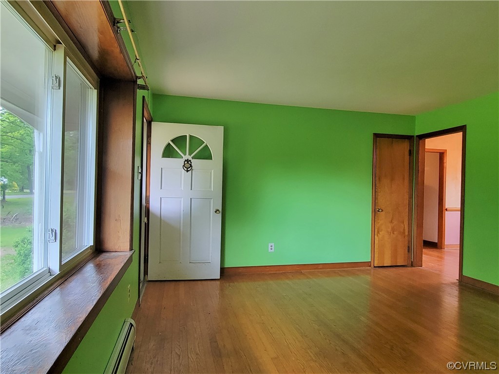 7529 Wilton Road Henrico, VA 23231 - Photo 2 of 31 a view of a livingroom with wooden floor and doors