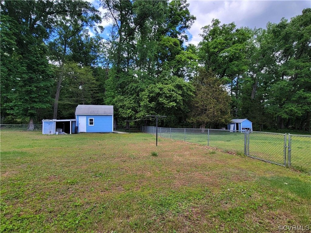 7529 Wilton Road Henrico, VA 23231 - Photo 26 of 31 a backyard of a house with lots of green space