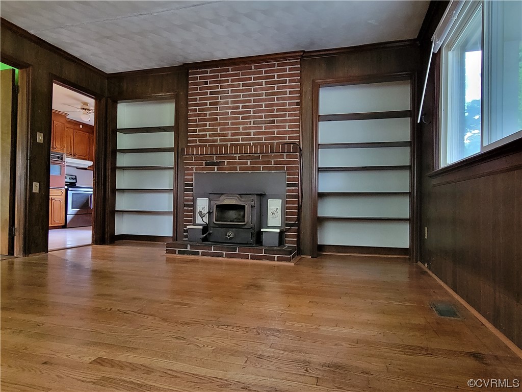 7529 Wilton Road Henrico, VA 23231 - Photo 7 of 31 a view of an empty room with a fireplace and window