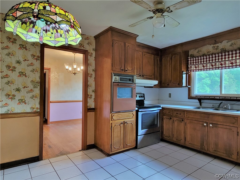 7529 Wilton Road Henrico, VA 23231 - Photo 8 of 31 a kitchen with stainless steel appliances granite countertop a sink and a refrigerator