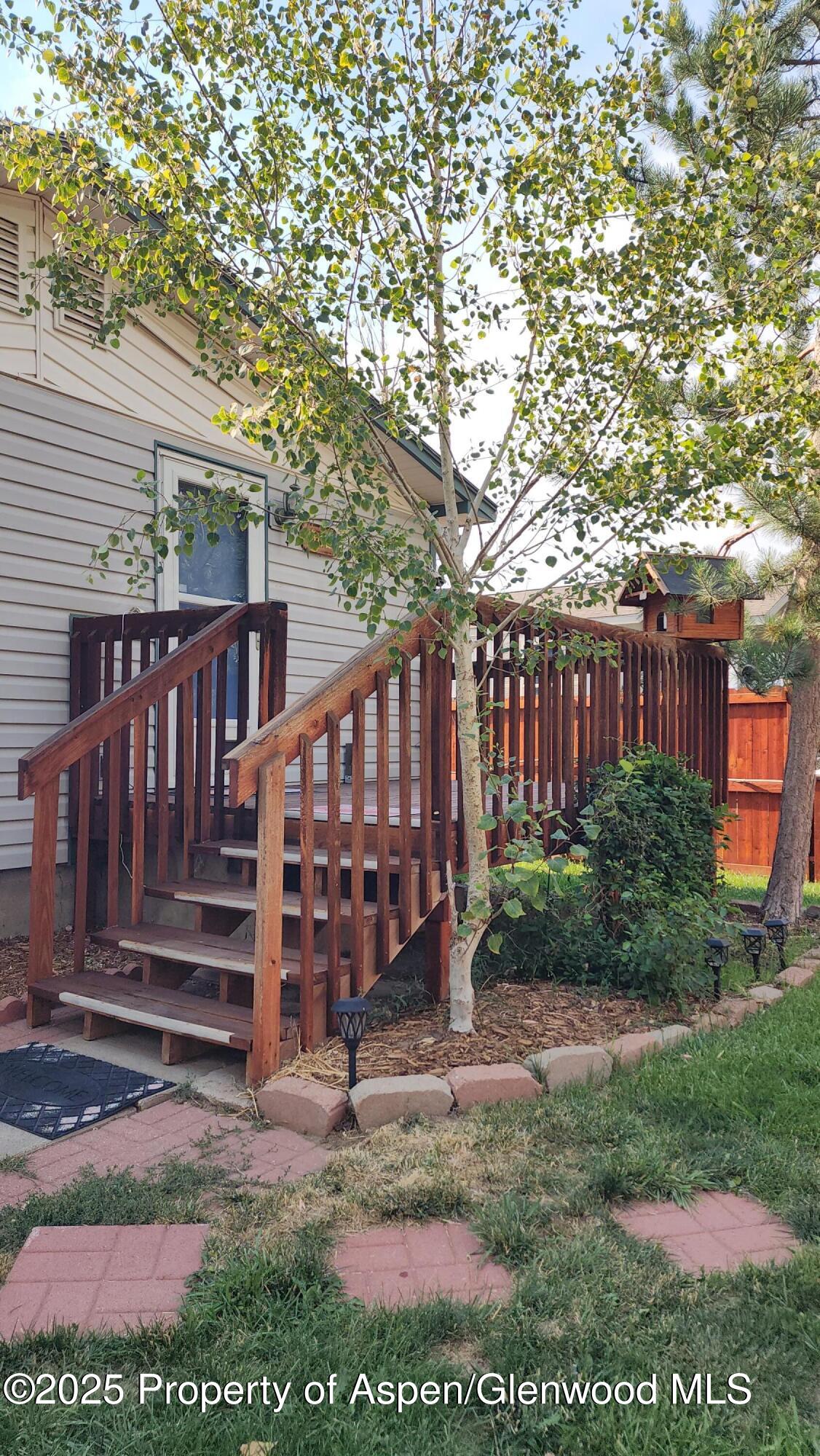 562 Rose Street Craig, CO 81625 - Photo 14 of 59 a view of a wooden deck front of house