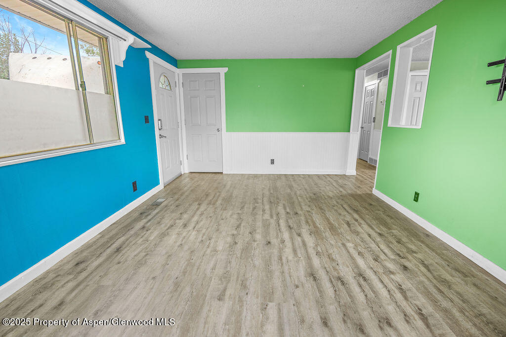 562 Rose Street Craig, CO 81625 - Photo 23 of 59 a view of a room with wooden floor and a window