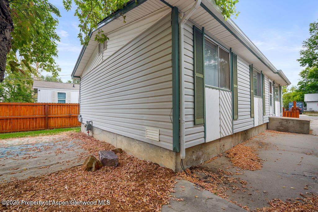 562 Rose Street Craig, CO 81625 - Photo 38 of 59 a view of a house with a yard