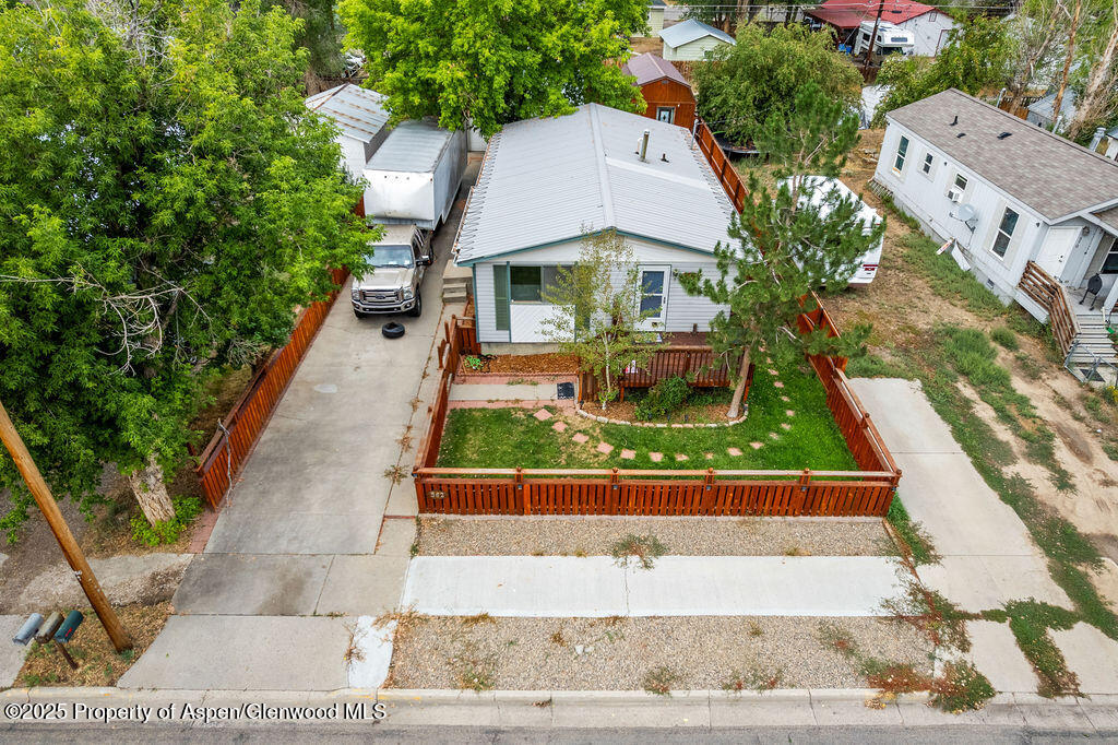 562 Rose Street Craig, CO 81625 - Photo 6 of 59 a view of house with garden space and sitting area