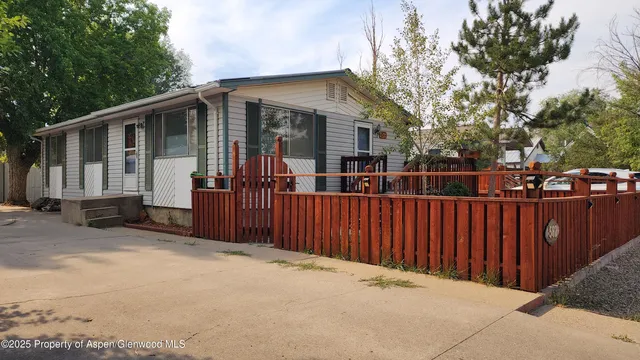 a view of outdoor space with deck and trees
