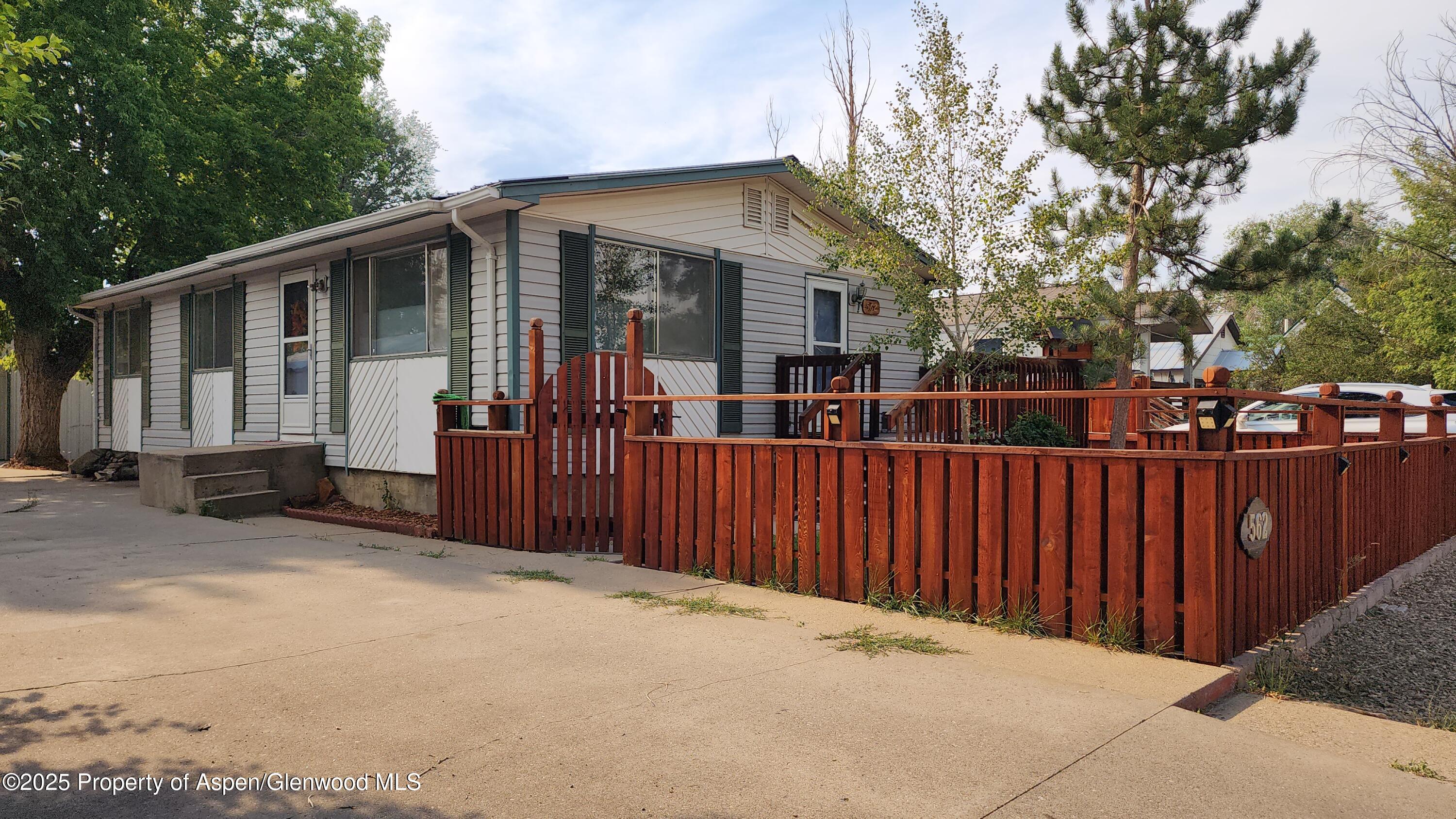 562 Rose Street Craig, CO 81625 - Photo 9 of 59 a view of a house with a wooden fence