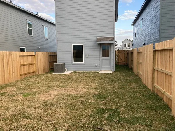 a view of a backyard of the house