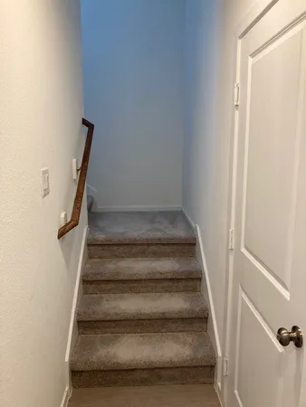 a bathroom with a sink toilet and a mirror