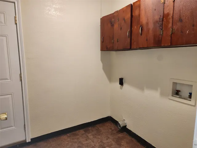 a view of storage area and wooden floor