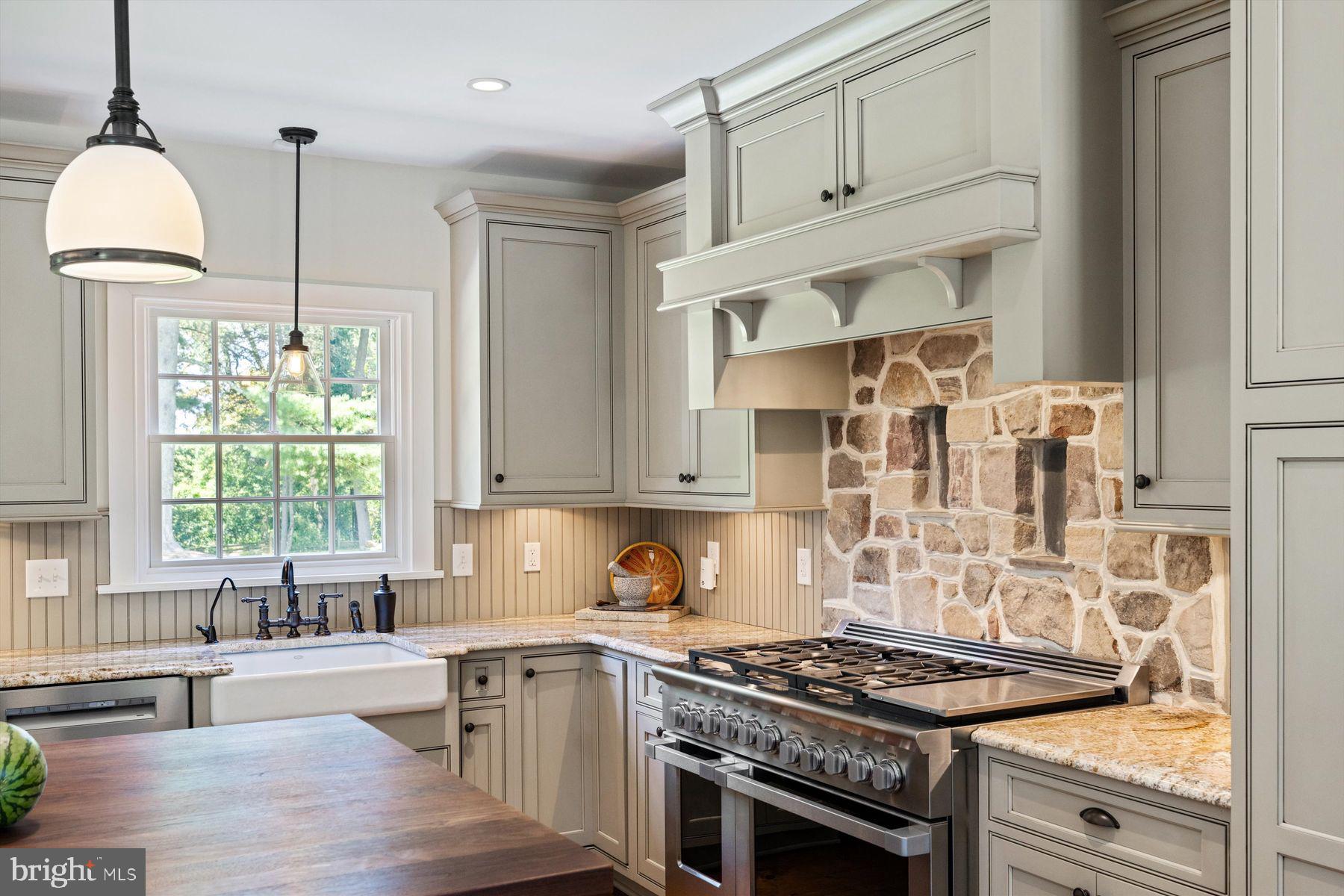 3087 Creamery Road New Hope, PA 18938 - Photo 13 of 68 a kitchen with stainless steel appliances granite countertop a stove and a sink