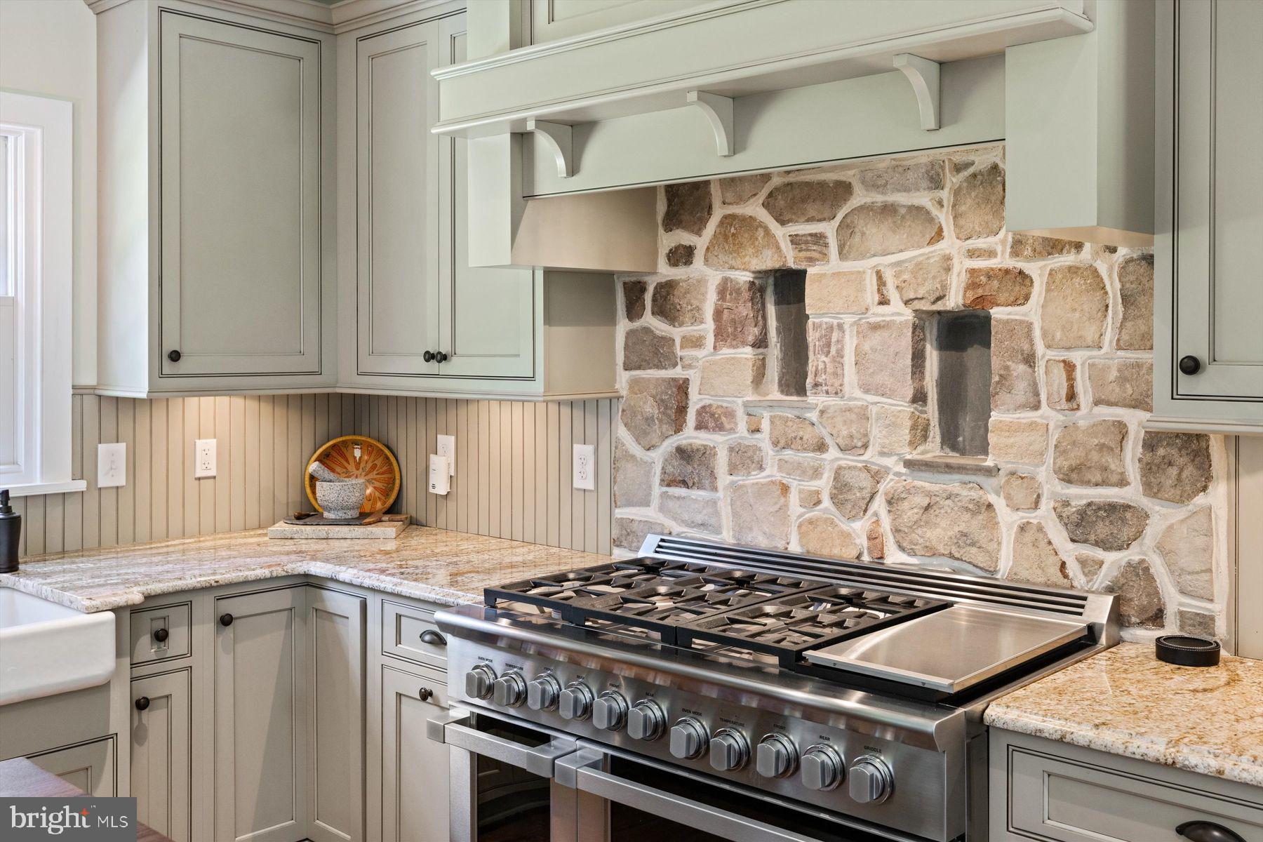 3087 Creamery Road New Hope, PA 18938 - Photo 14 of 68 a kitchen with granite countertop a stove sink and cabinets