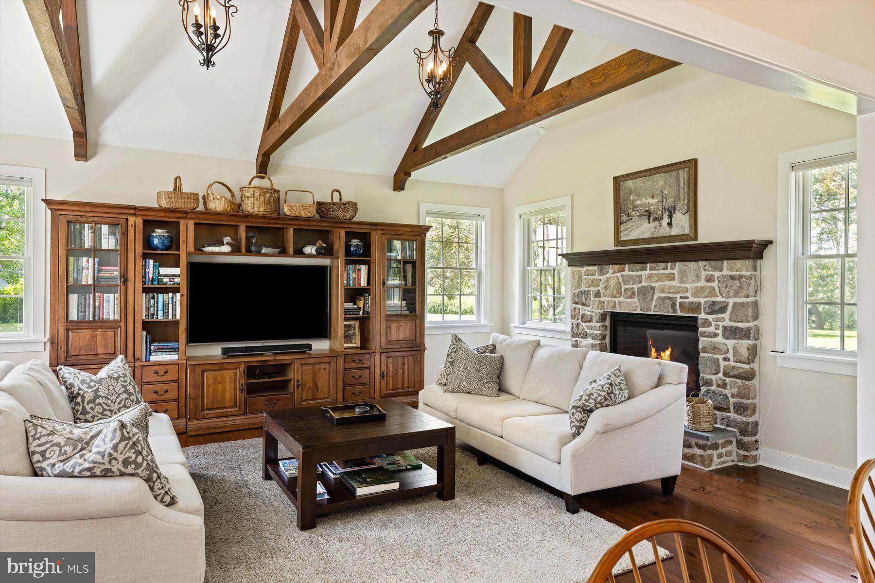 3087 Creamery Road New Hope, PA 18938 - Photo 23 of 68 a living room with furniture and a flat screen tv