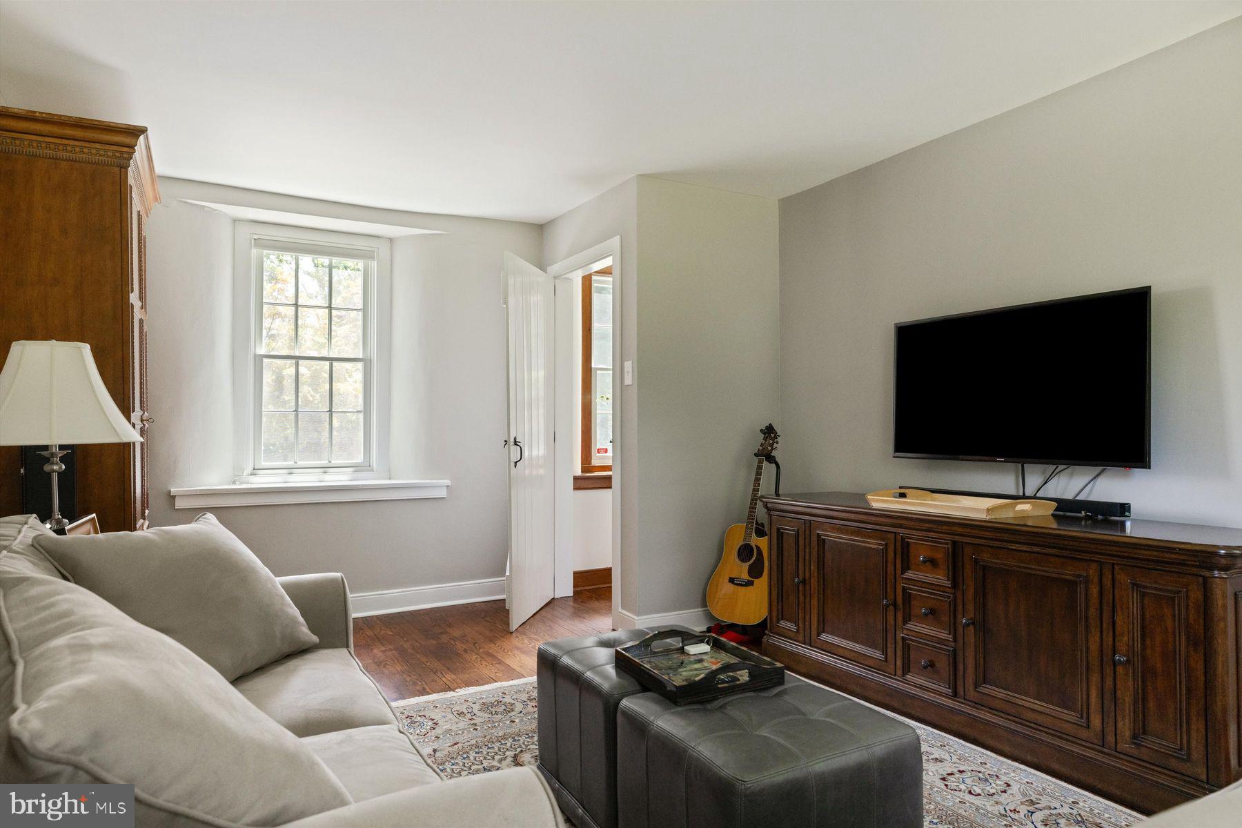 3087 Creamery Road New Hope, PA 18938 - Photo 37 of 68 a living room with furniture and a flat screen tv