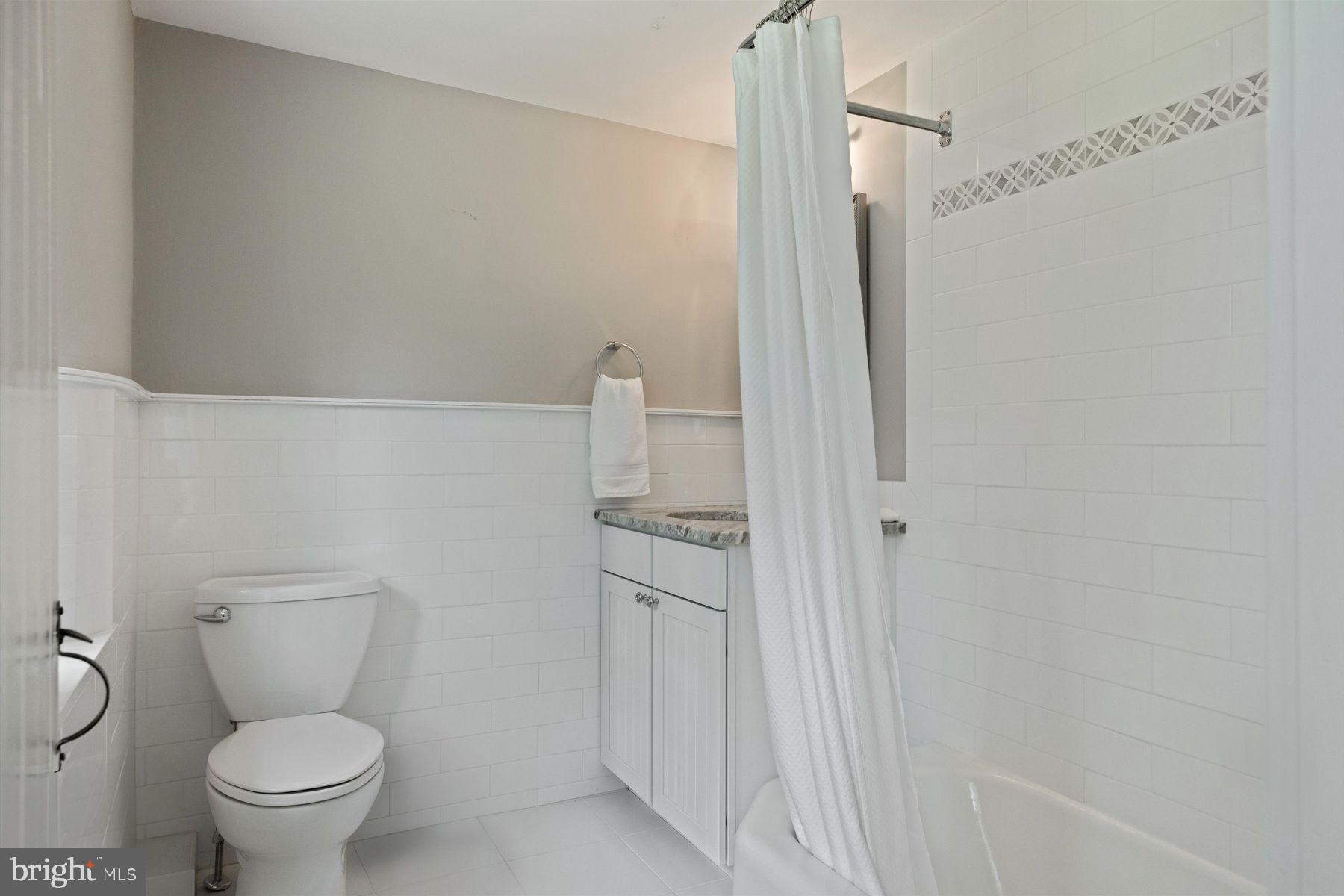 3087 Creamery Road New Hope, PA 18938 - Photo 42 of 68 a bathroom with a granite countertop toilet and a shower