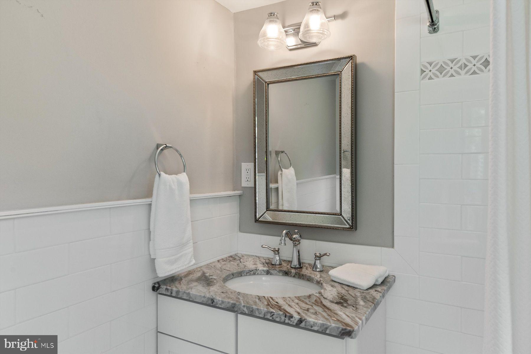 3087 Creamery Road New Hope, PA 18938 - Photo 43 of 68 a bathroom with a granite countertop sink and a mirror