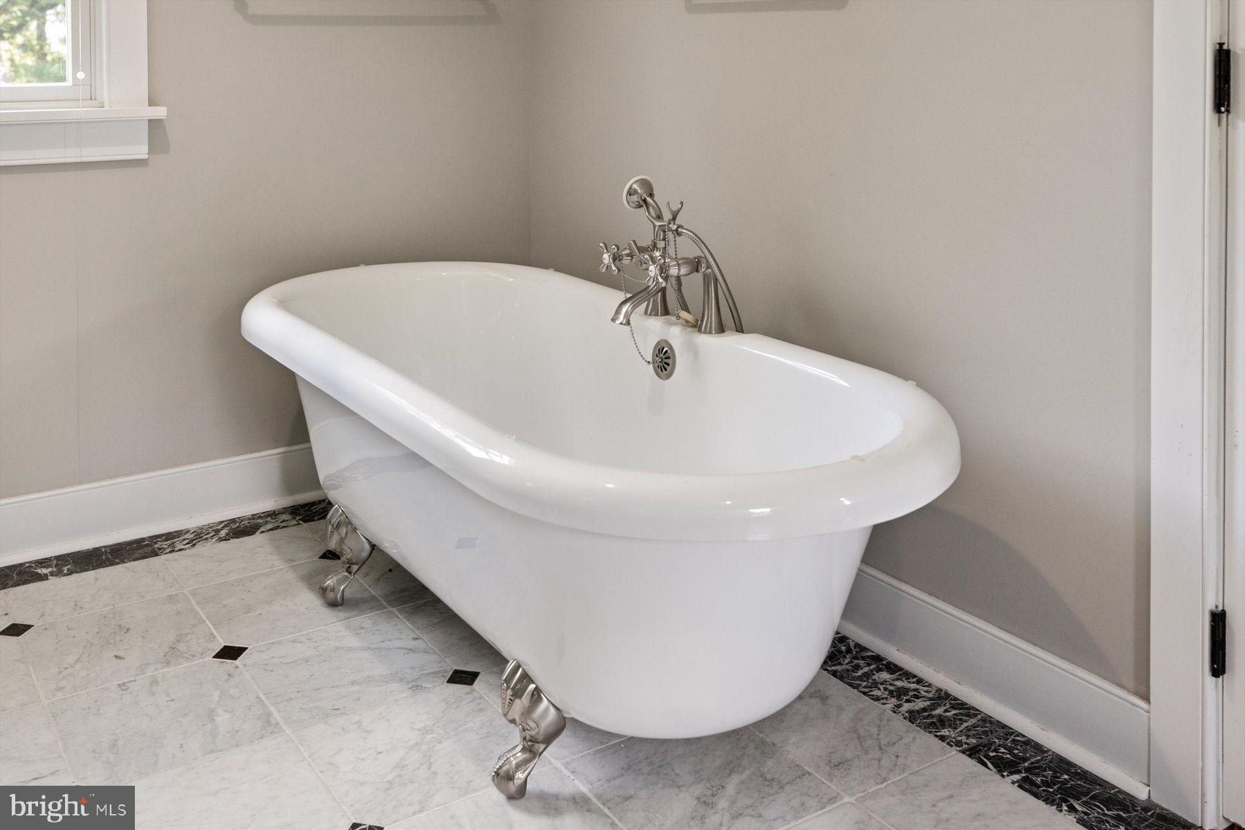 3087 Creamery Road New Hope, PA 18938 - Photo 58 of 68 a white bath tub sitting in a bathroom
