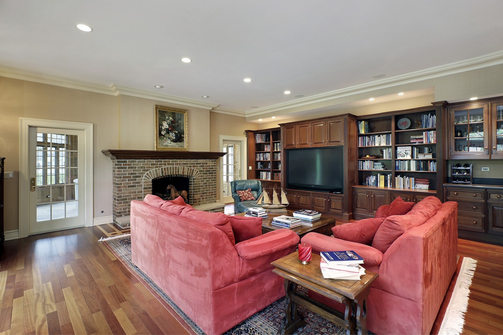 578 Sunset Ridge Road Northfield, IL 60093 - Photo 10 of 21 a living room with furniture a flat screen tv and a fireplace