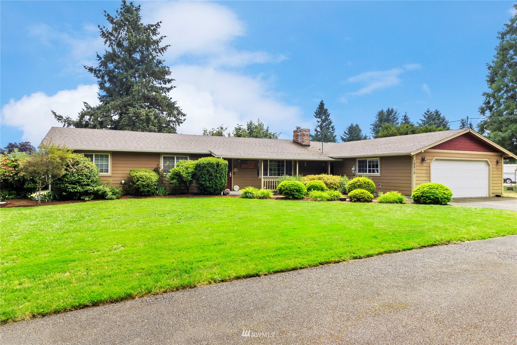 18810 Nutmeg Street Southwest Rochester, WA 98579 - Photo 1 of 26 a front view of a house with a yard
