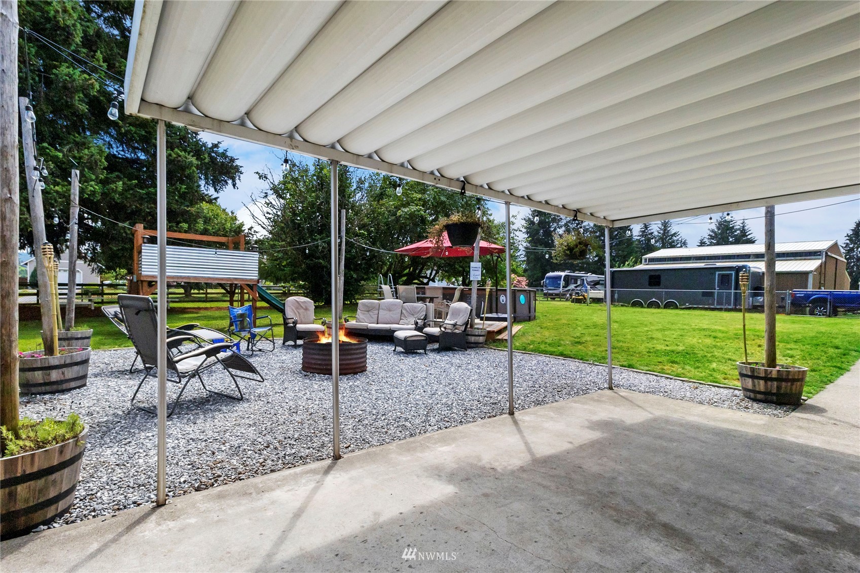 18810 Nutmeg Street Southwest Rochester, WA 98579 - Photo 24 of 26 a view of a patio with a table and chairs