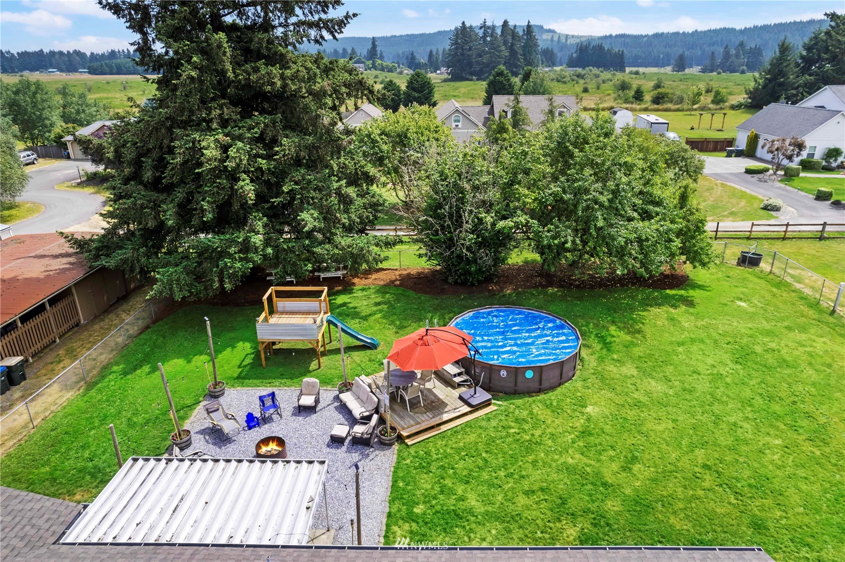 18810 Nutmeg Street Southwest Rochester, WA 98579 - Photo 10 of 26 an aerial view of a house with outdoor space pool seating area and yard