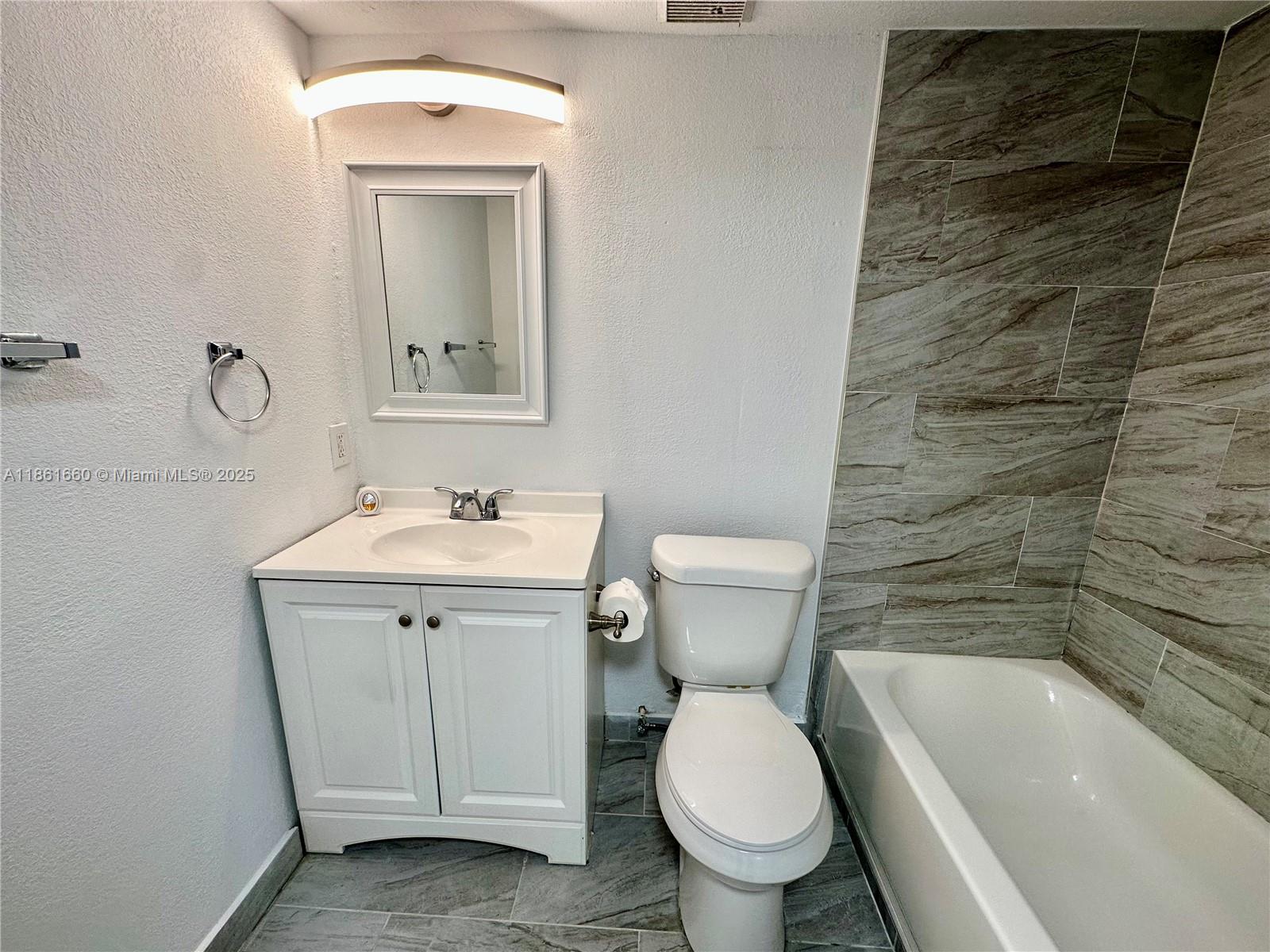 Playland Hollywood, FL 33021 - Photo 11 of 18 a bathroom with a sink toilet and shower