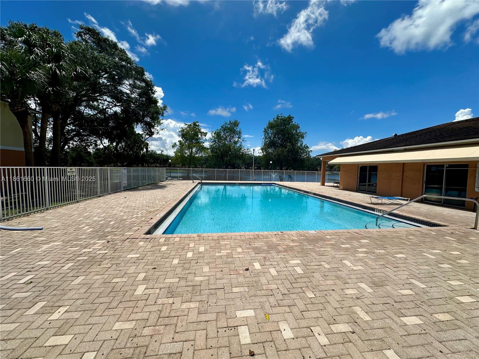 Playland Hollywood, FL 33021 - Photo 14 of 18 a view of swimming pool with chairs
