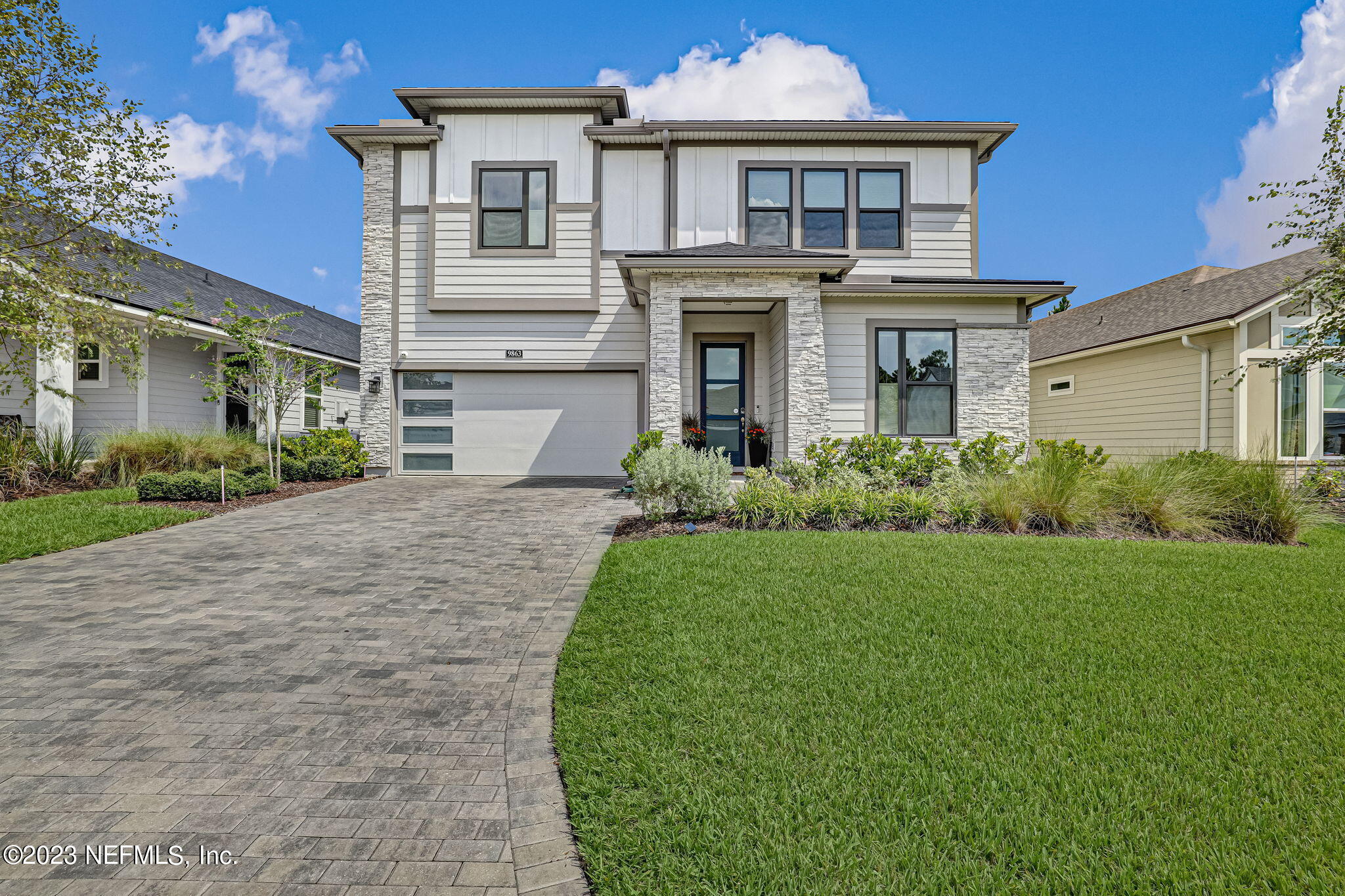 a front view of a house with a yard
