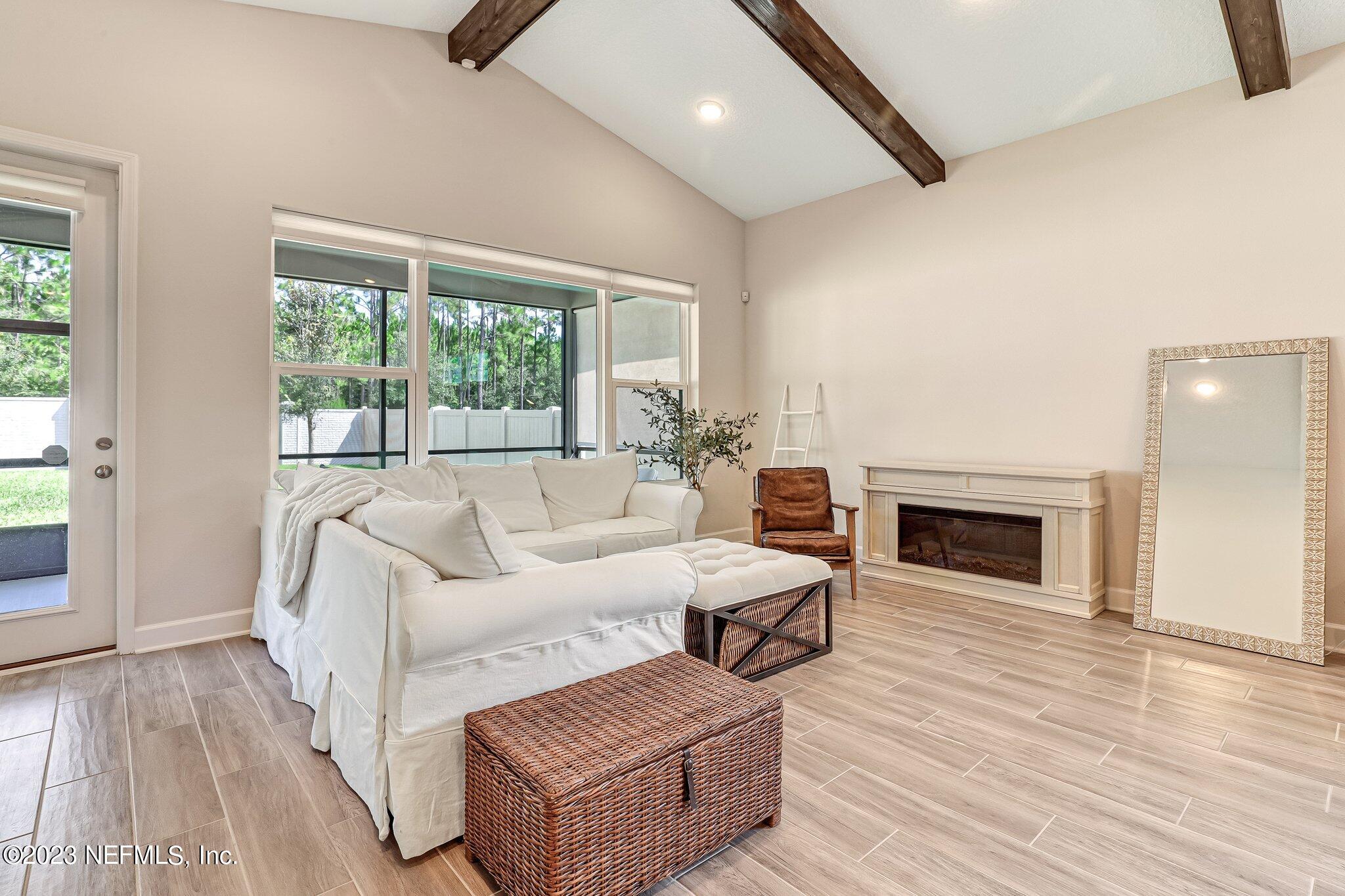 9863 Invention Lane Jacksonville, FL 32256 - Photo 11 of 56 a living room with furniture and a fireplace