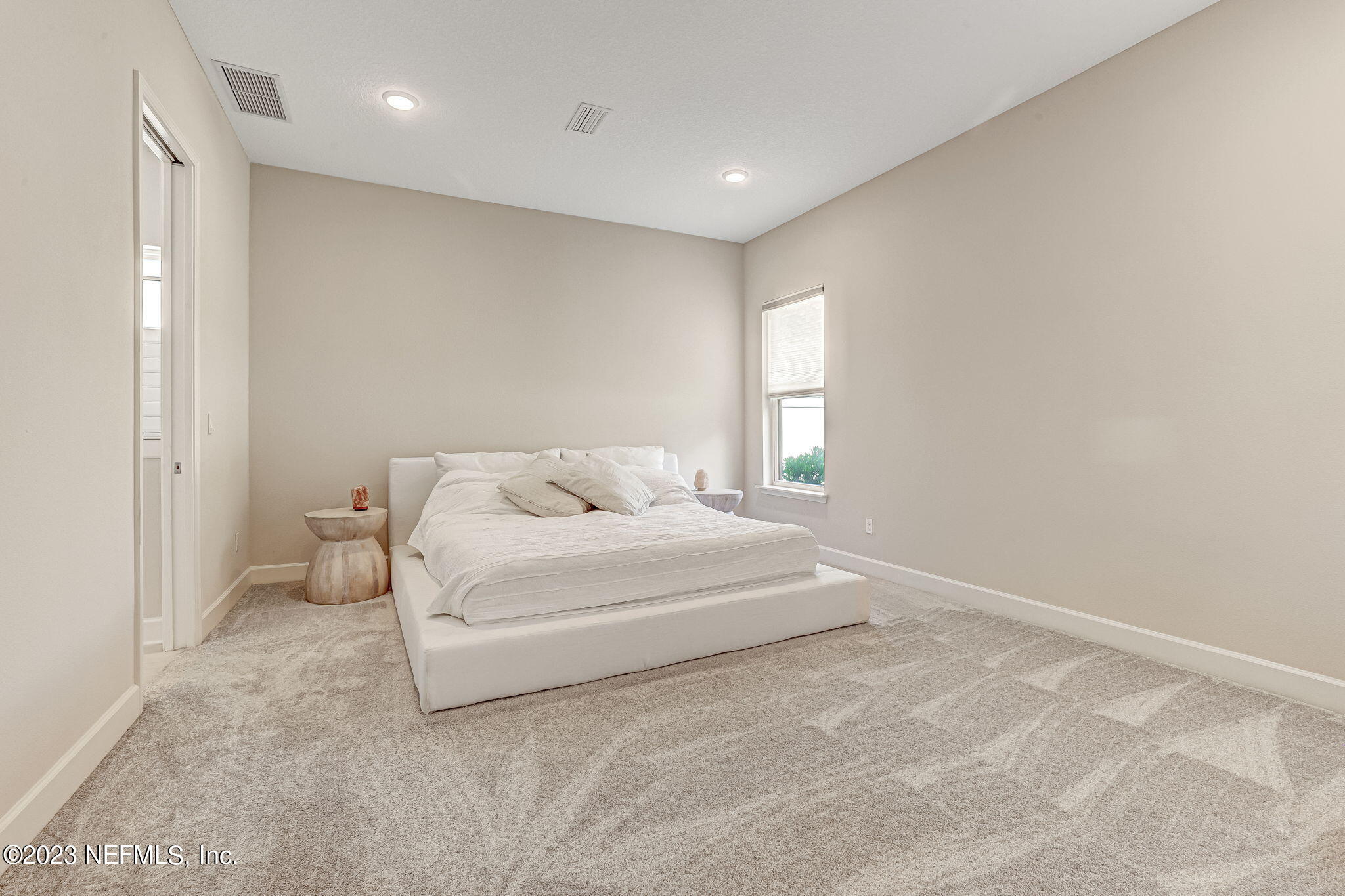 9863 Invention Lane Jacksonville, FL 32256 - Photo 23 of 56 a large white bed in a white room
