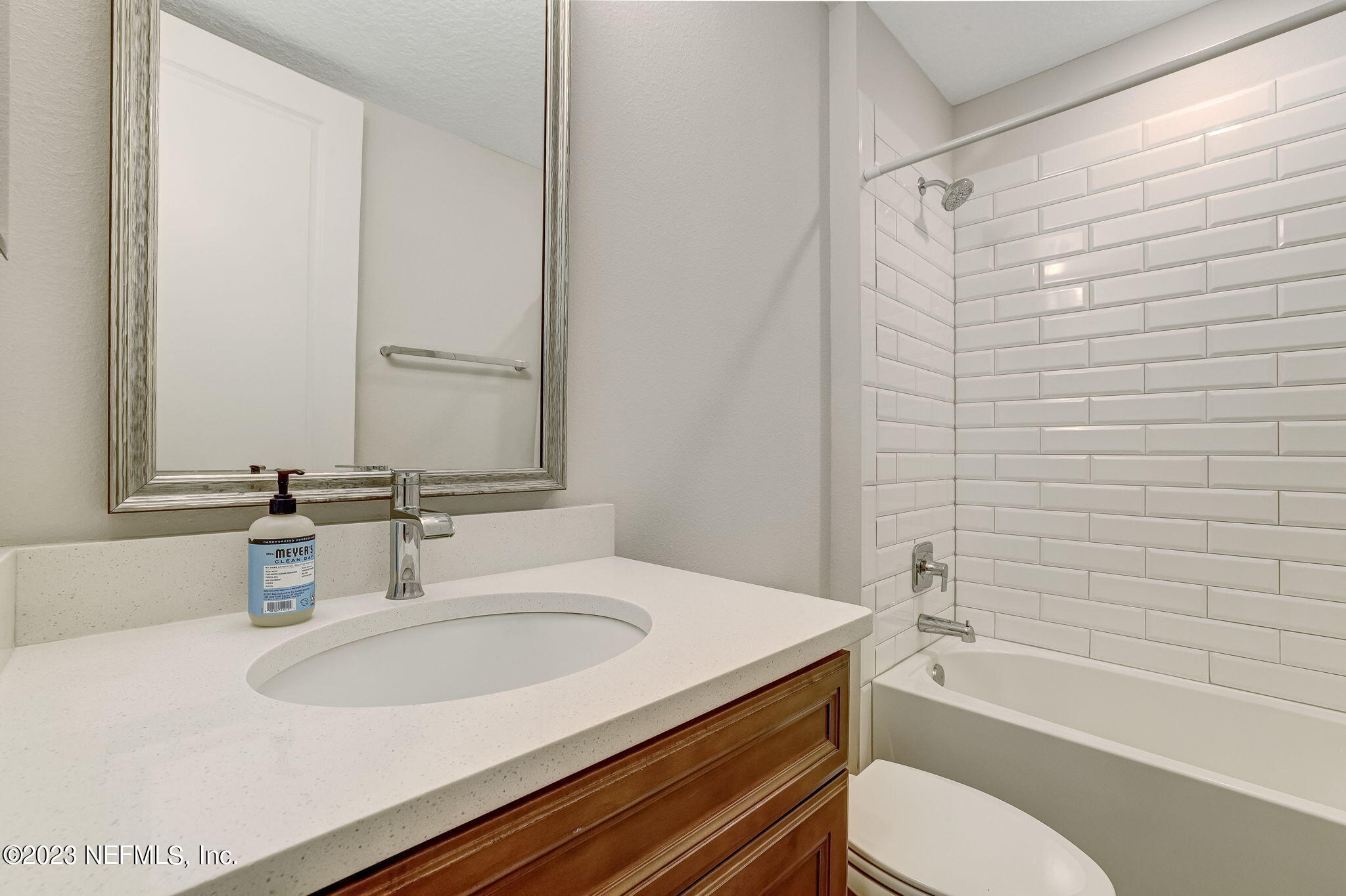 9863 Invention Lane Jacksonville, FL 32256 - Photo 31 of 56 a bathroom with a granite countertop sink toilet and shower