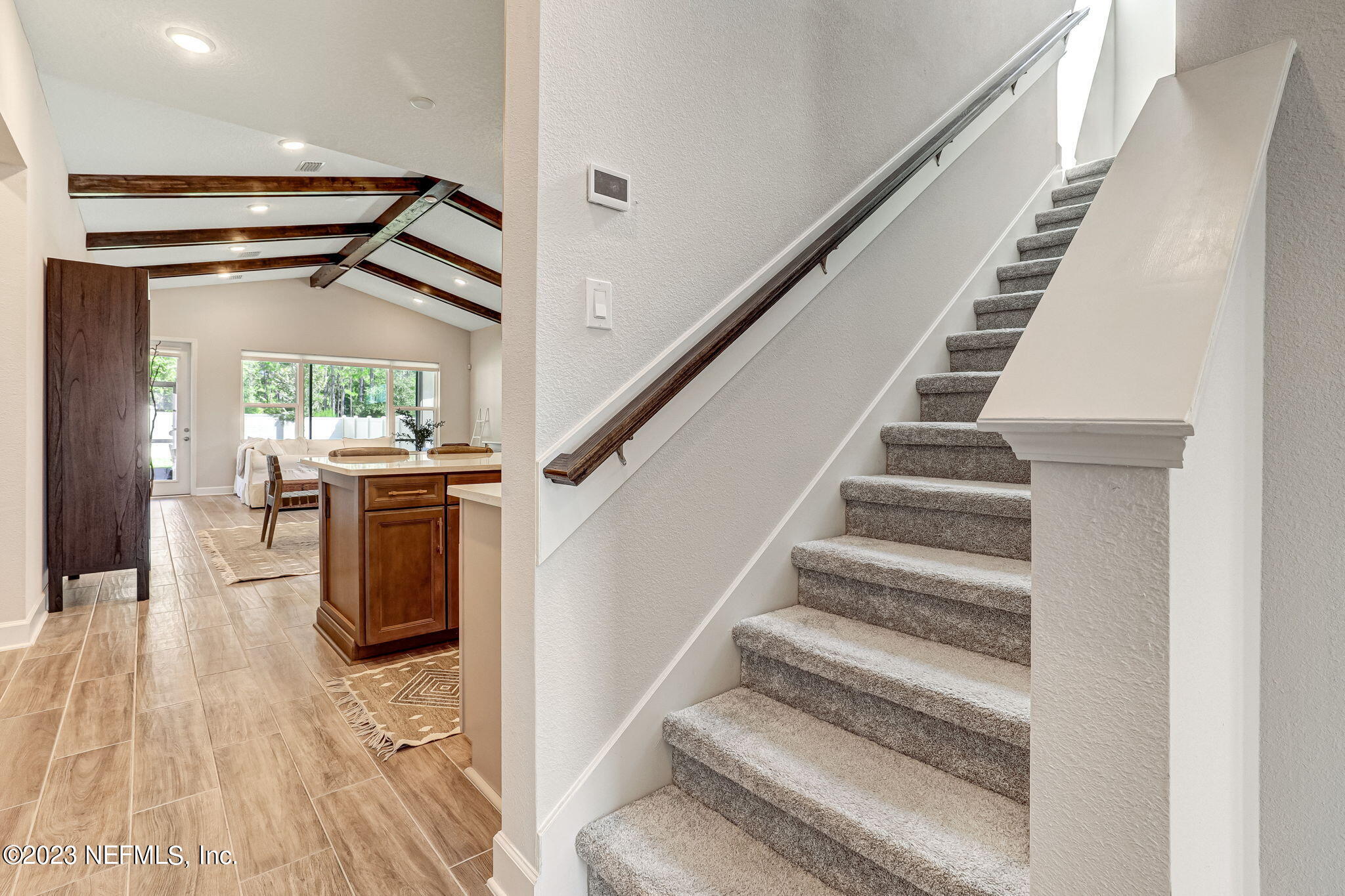 9863 Invention Lane Jacksonville, FL 32256 - Photo 32 of 56 a view of entryway and hall with wooden floor