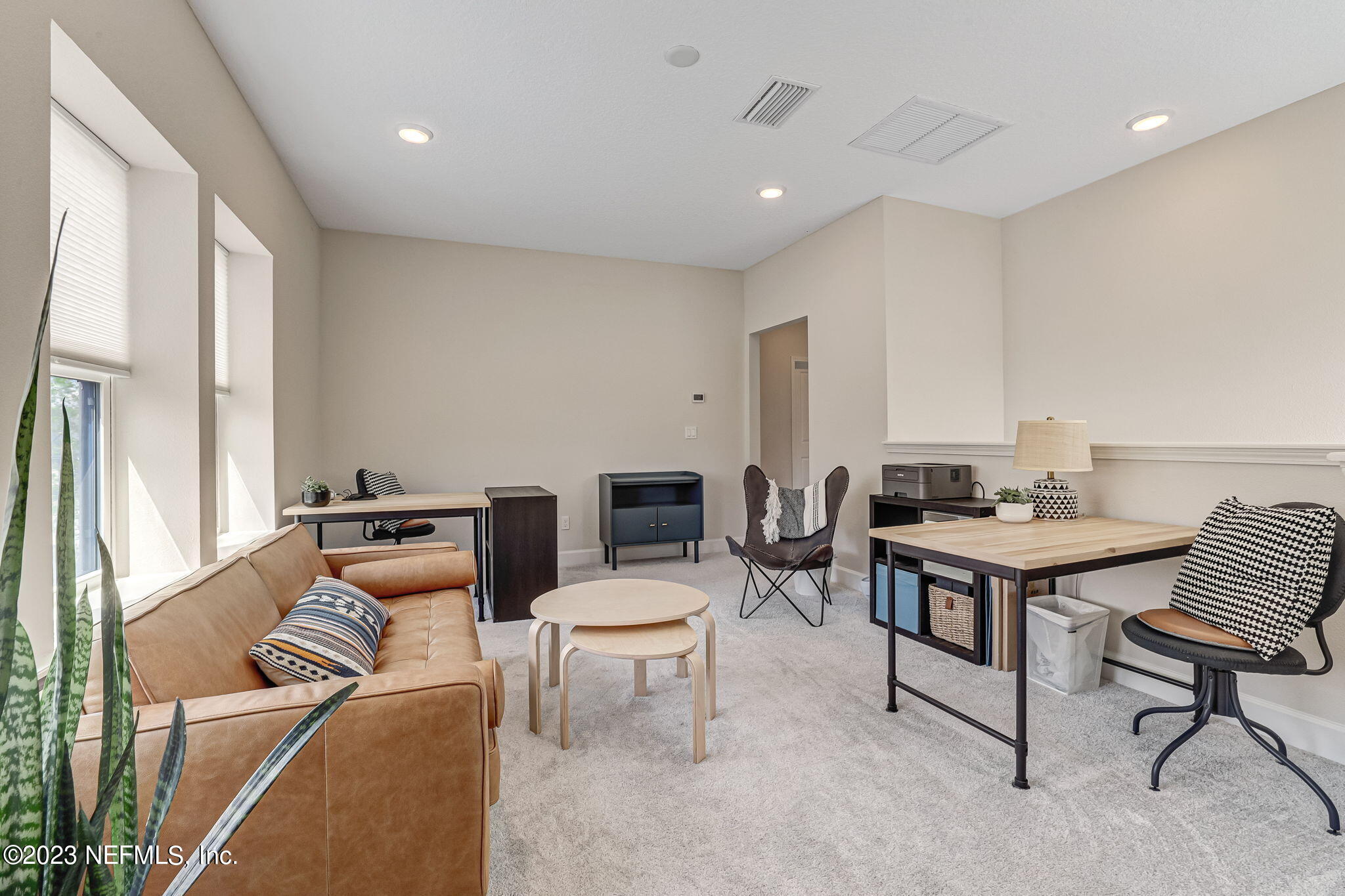 9863 Invention Lane Jacksonville, FL 32256 - Photo 33 of 56 a living room with furniture a rug and a piano