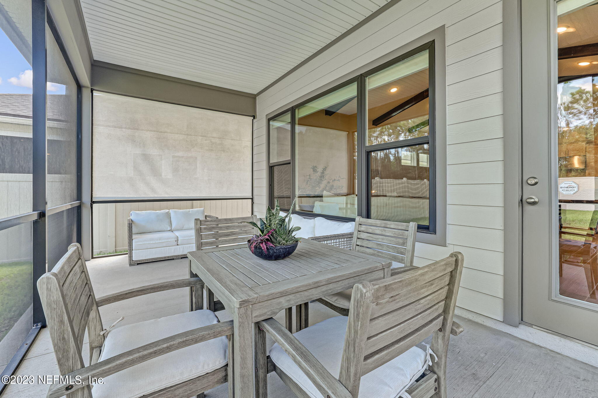 9863 Invention Lane Jacksonville, FL 32256 - Photo 45 of 56 a view of an outdoor dining space with a table and chairs
