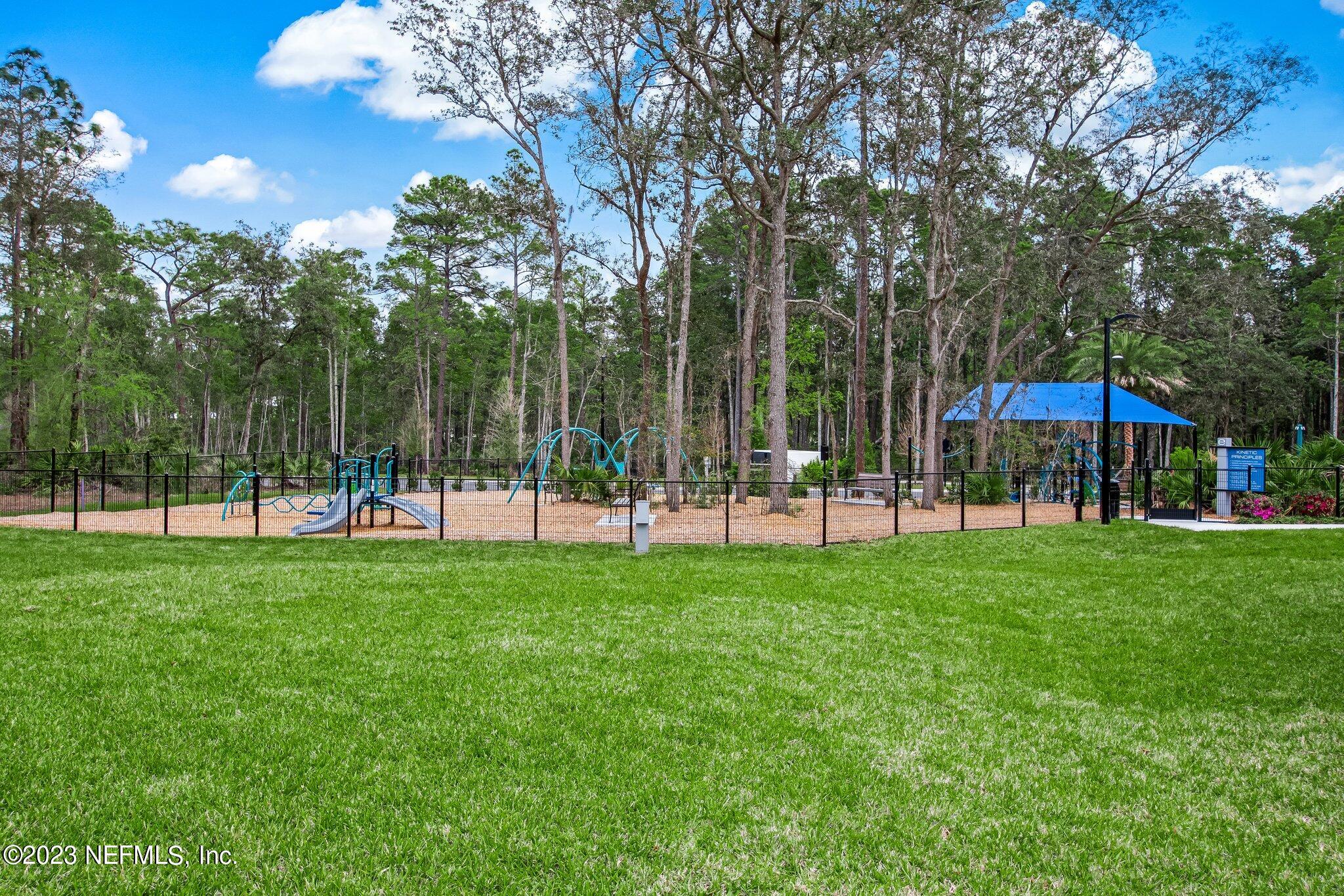 9863 Invention Lane Jacksonville, FL 32256 - Photo 55 of 56 a view of a park with a slide