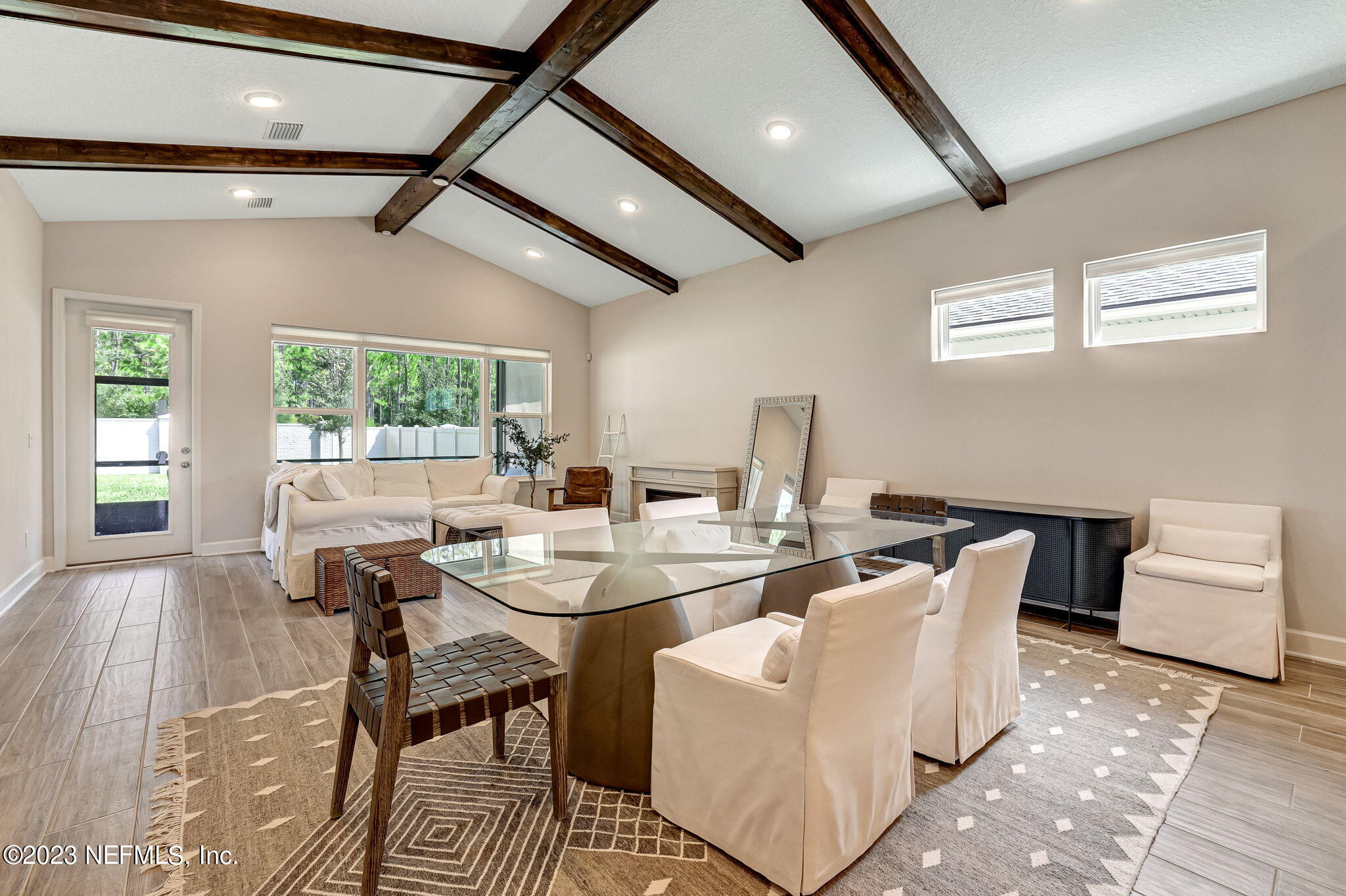 9863 Invention Lane Jacksonville, FL 32256 - Photo 10 of 56 a view of a dining room with furniture window and outside view