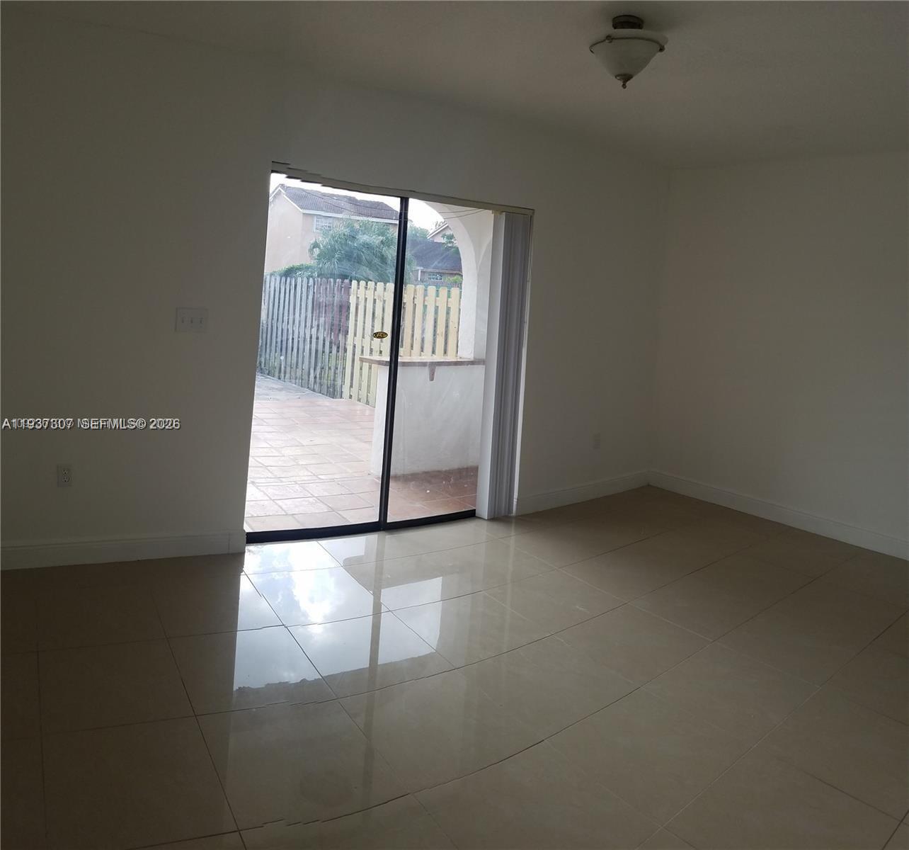 13516 Southwest 59th Lane Miami, FL 33183 - Photo 13 of 20 an empty room with a window