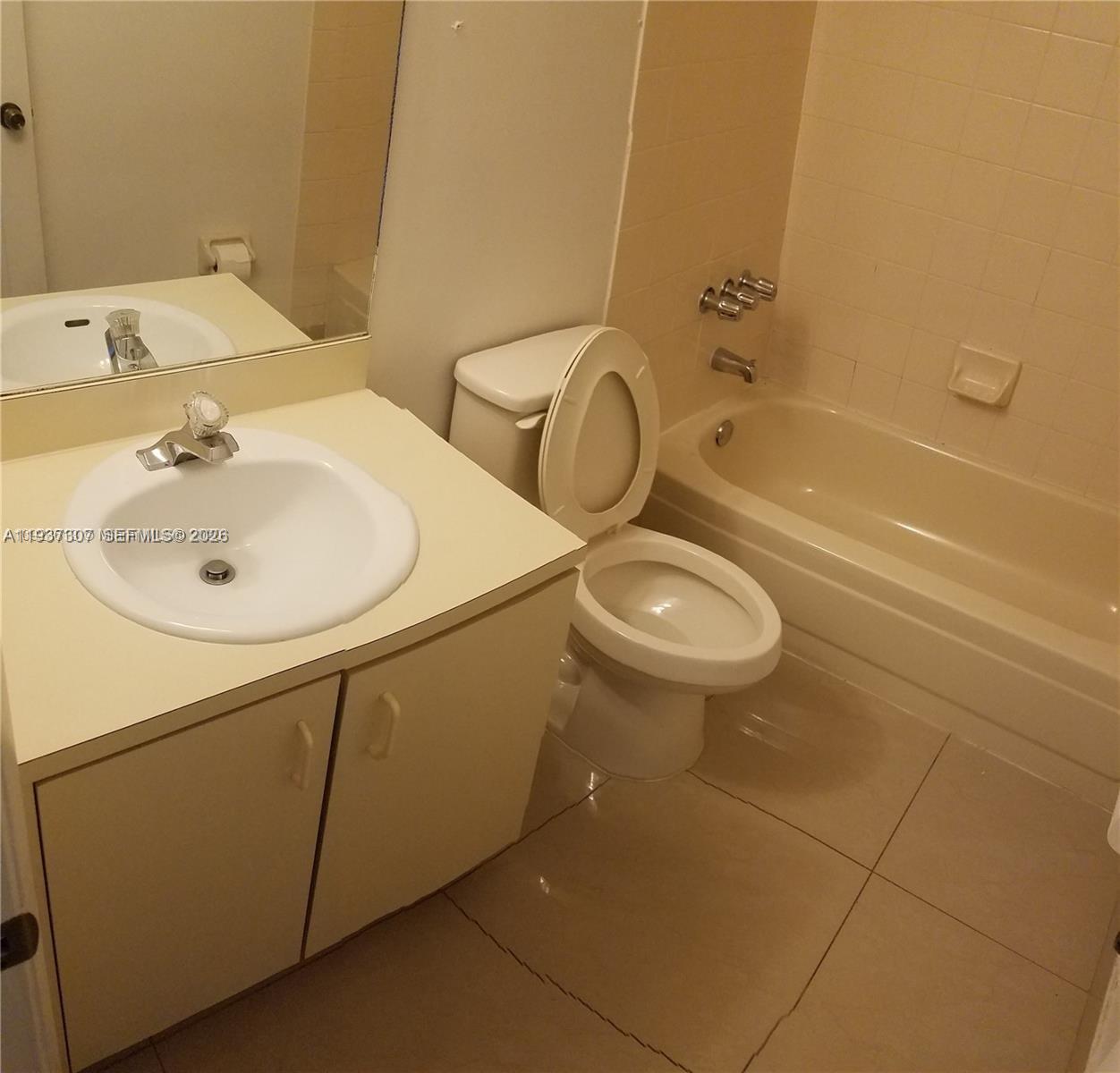 13516 Southwest 59th Lane Miami, FL 33183 - Photo 14 of 20 a bathroom with a sink and a toilet