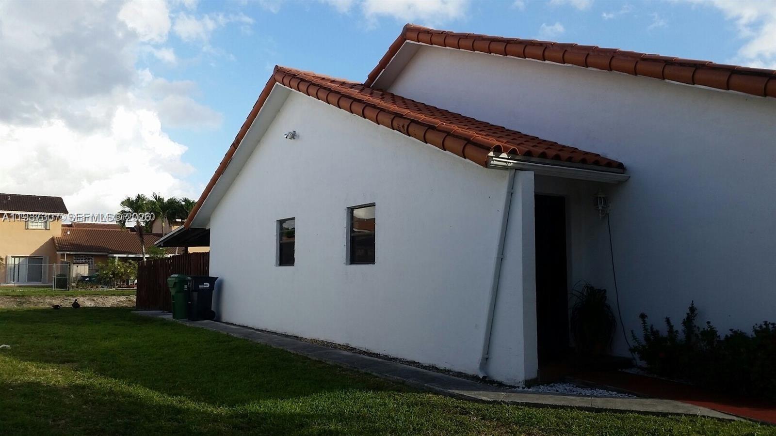 13516 Southwest 59th Lane Miami, FL 33183 - Photo 18 of 20 a view of house with backyard