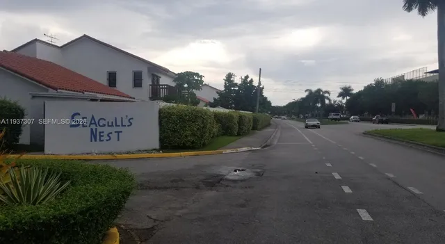 a view of a street with houses