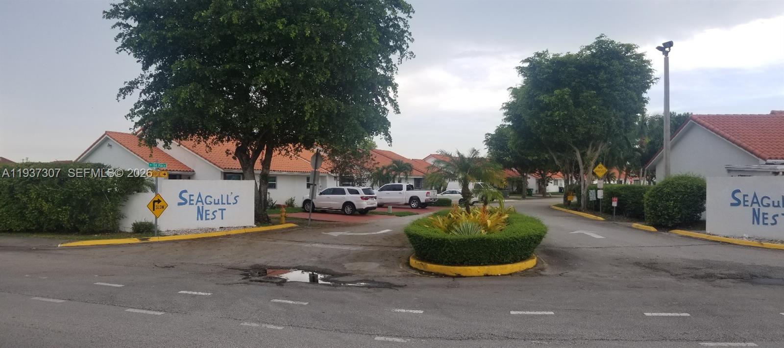 13516 Southwest 59th Lane Miami, FL 33183 - Photo 6 of 20 a view of a street with fire pit