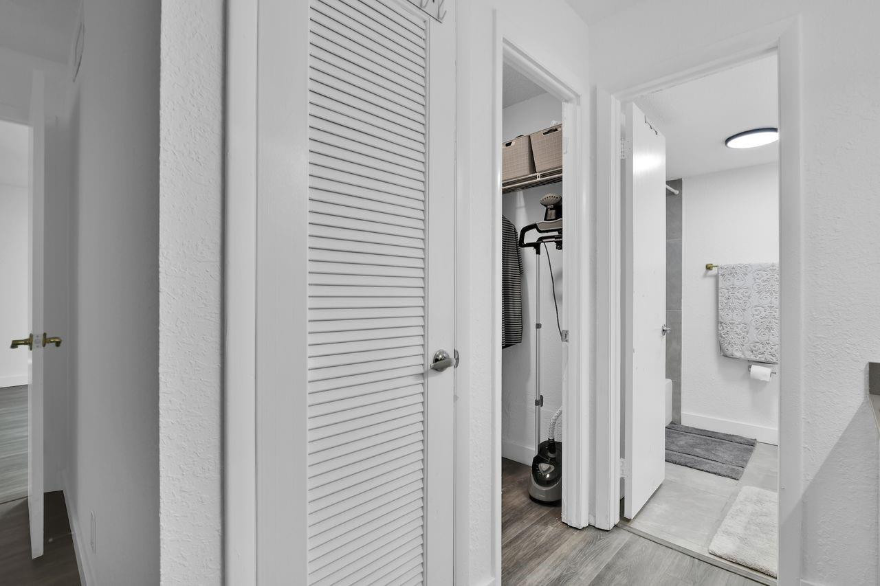 250 Northwest 67th Street, Unit 322 Boca Raton, FL 33487 - Photo 8 of 15 a view of a bathroom with a shower and a sink