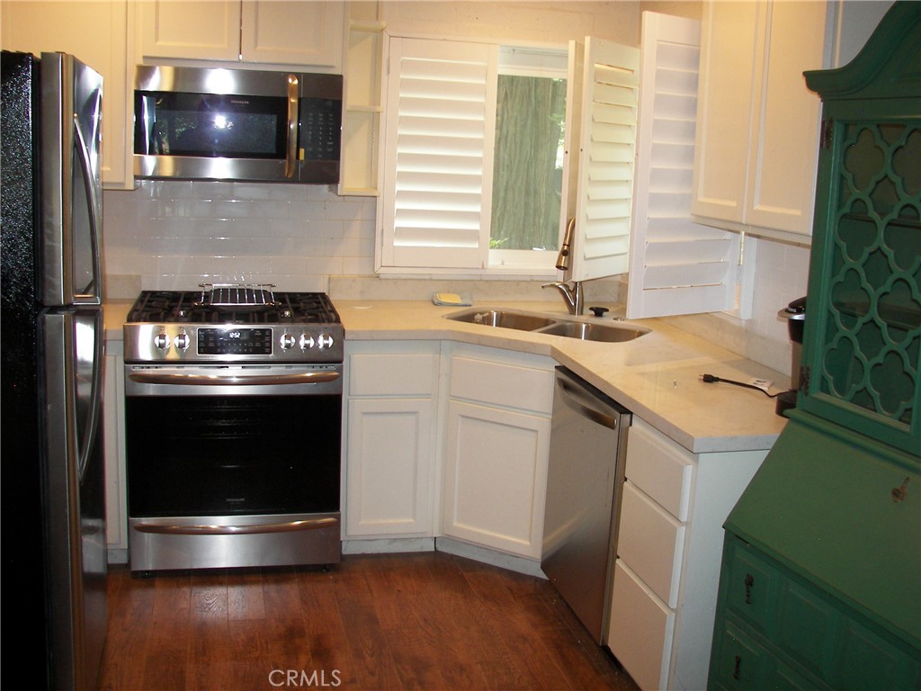 1101 Big Tree Lane Crestline, CA 92325 - Photo 11 of 30 a kitchen with a stove and a sink