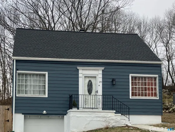 a front view of a house with garage