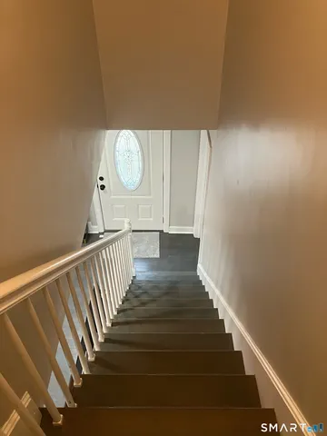 a bathroom with a shower and mirror