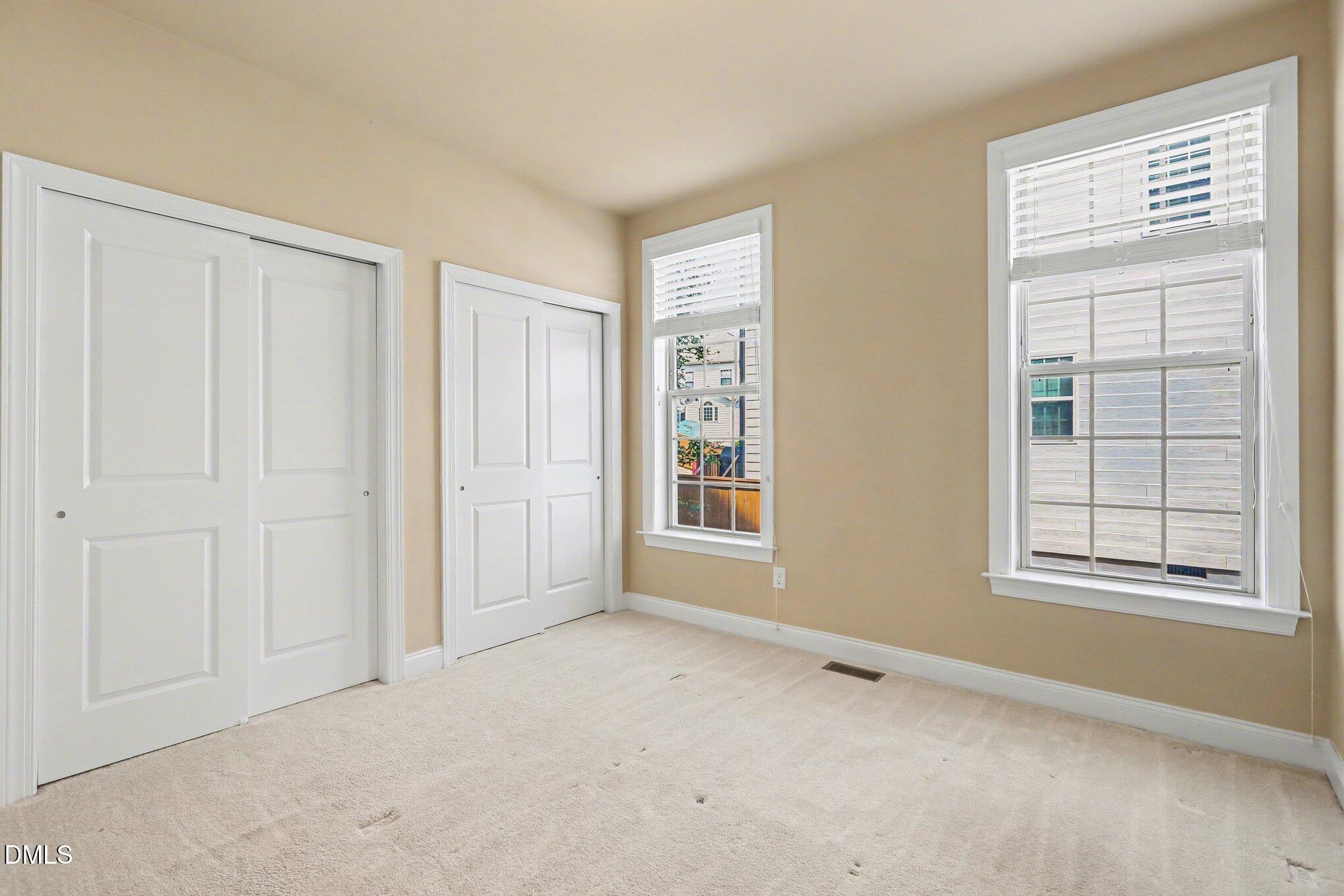 351 Gartrell Way Cary, NC 27519 - Photo 22 of 51 an empty room with windows