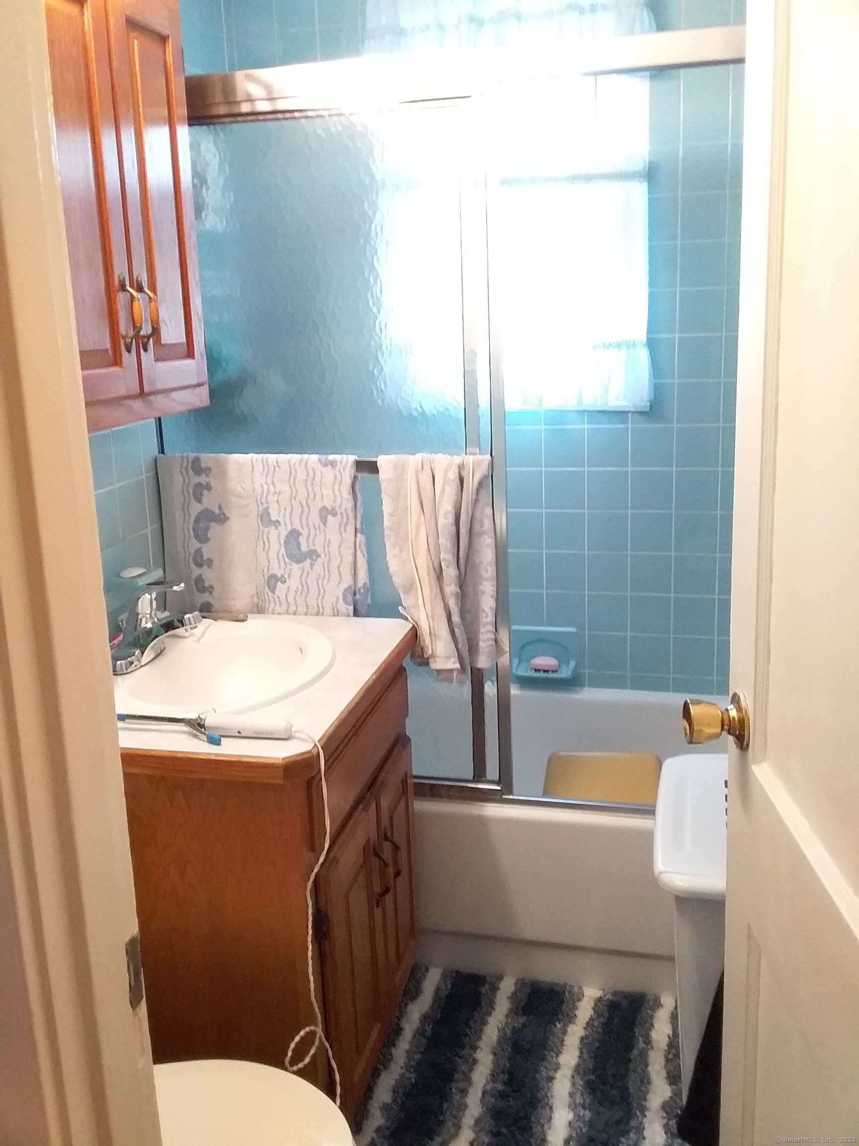 440 Success Avenue, Unit BLDG86 18 Bridgeport, CT 06610 - Photo 8 of 8 a bathroom with a bathtub and a sink