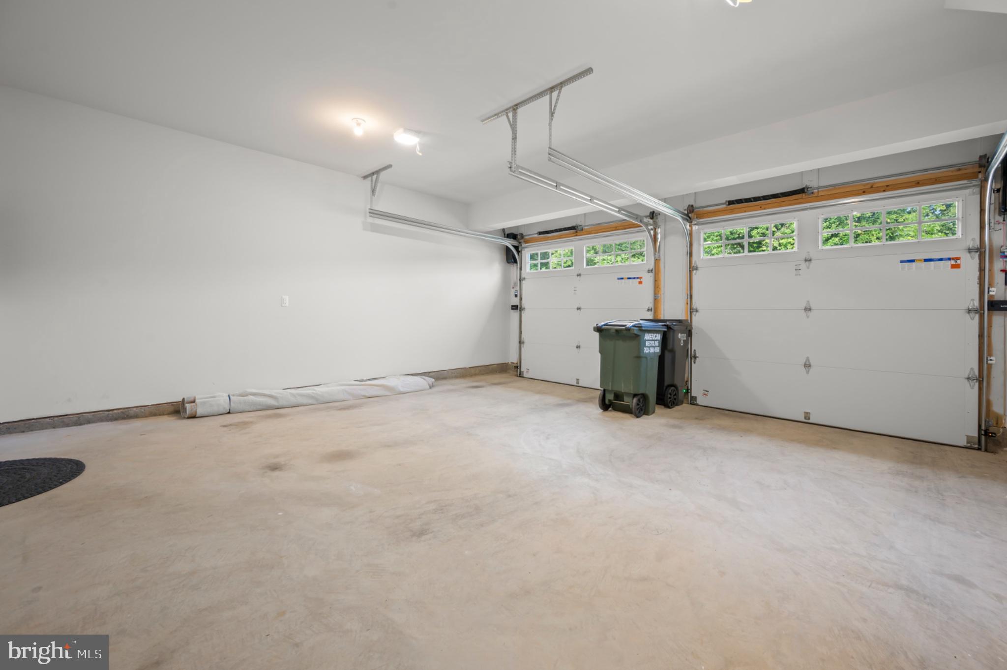 8702 Southrun Road Lorton, VA 22079 - Photo 26 of 35 2 car garage with automatic garage door openers